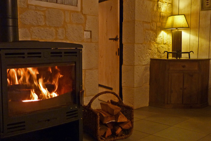 Woodburning stove in Grange Ozamis gite, Sarlat in the Dordogne